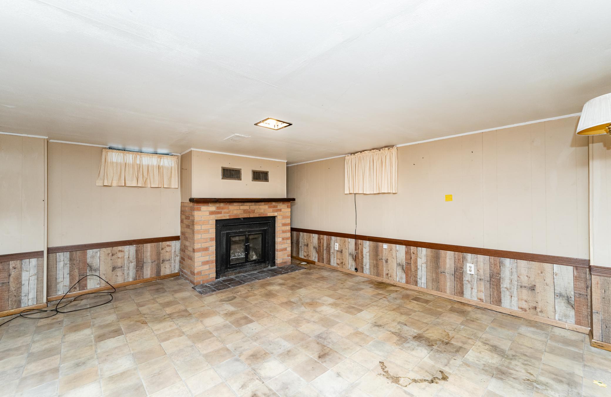 Lower level with wood burning fireplace.jpg