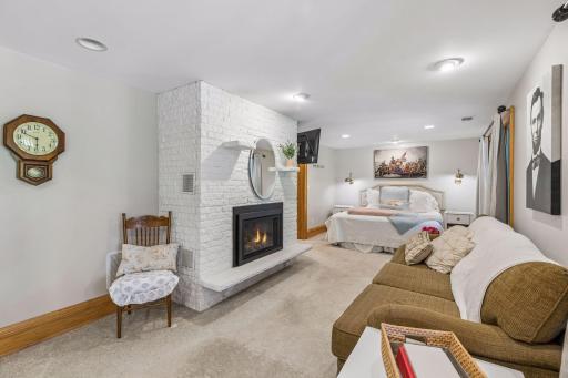 A cozy gas fireplace creates the perfect atmosphere within the primary suite.