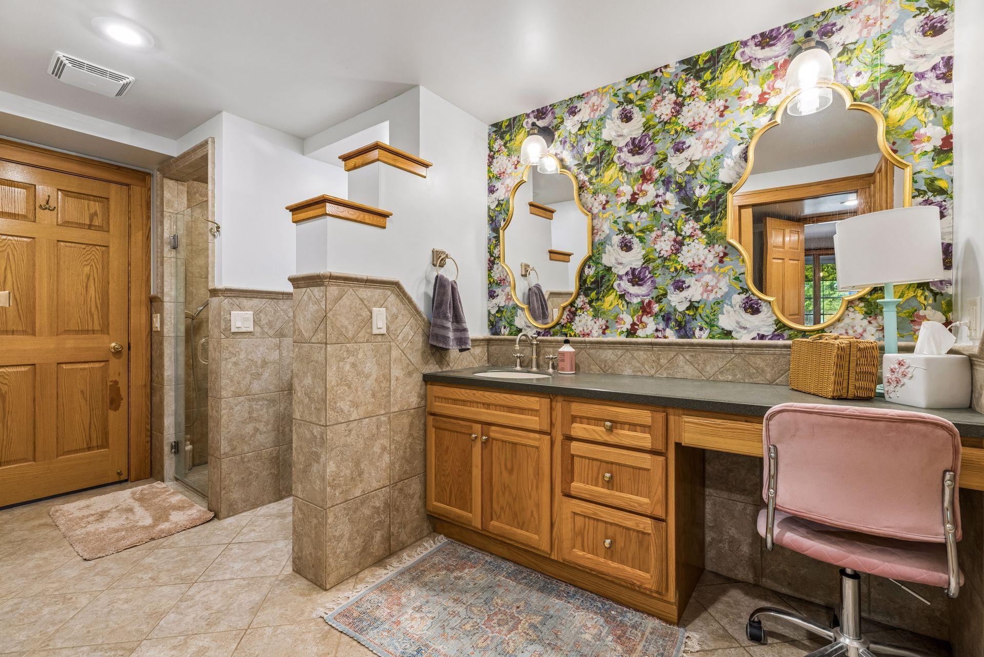 Private ¾ bath featuring a tiled shower.