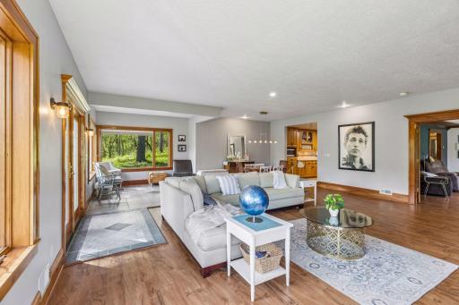 Large windows frame beautiful views of the property, bringing the outdoors in.