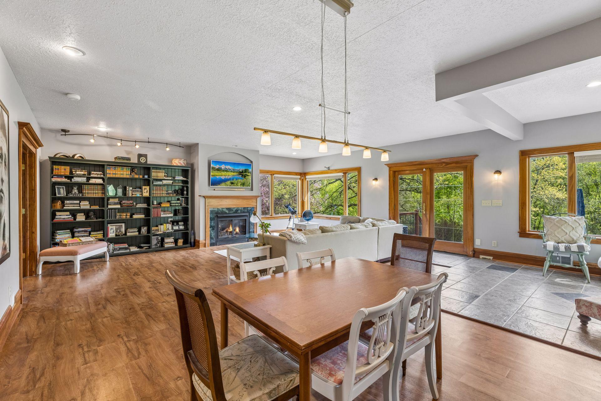 A natural transition into the living room, complete with a second gas fireplace.