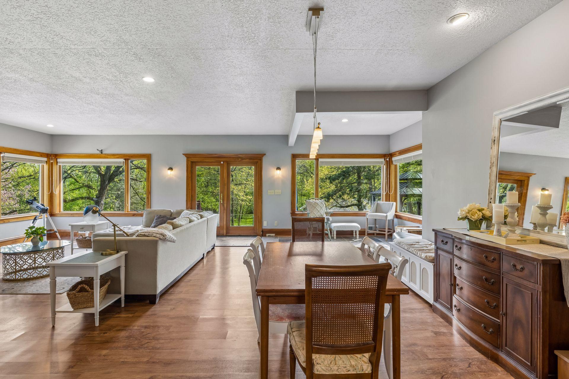 Surrounded by windows, the dining space offers stunning views in every season.