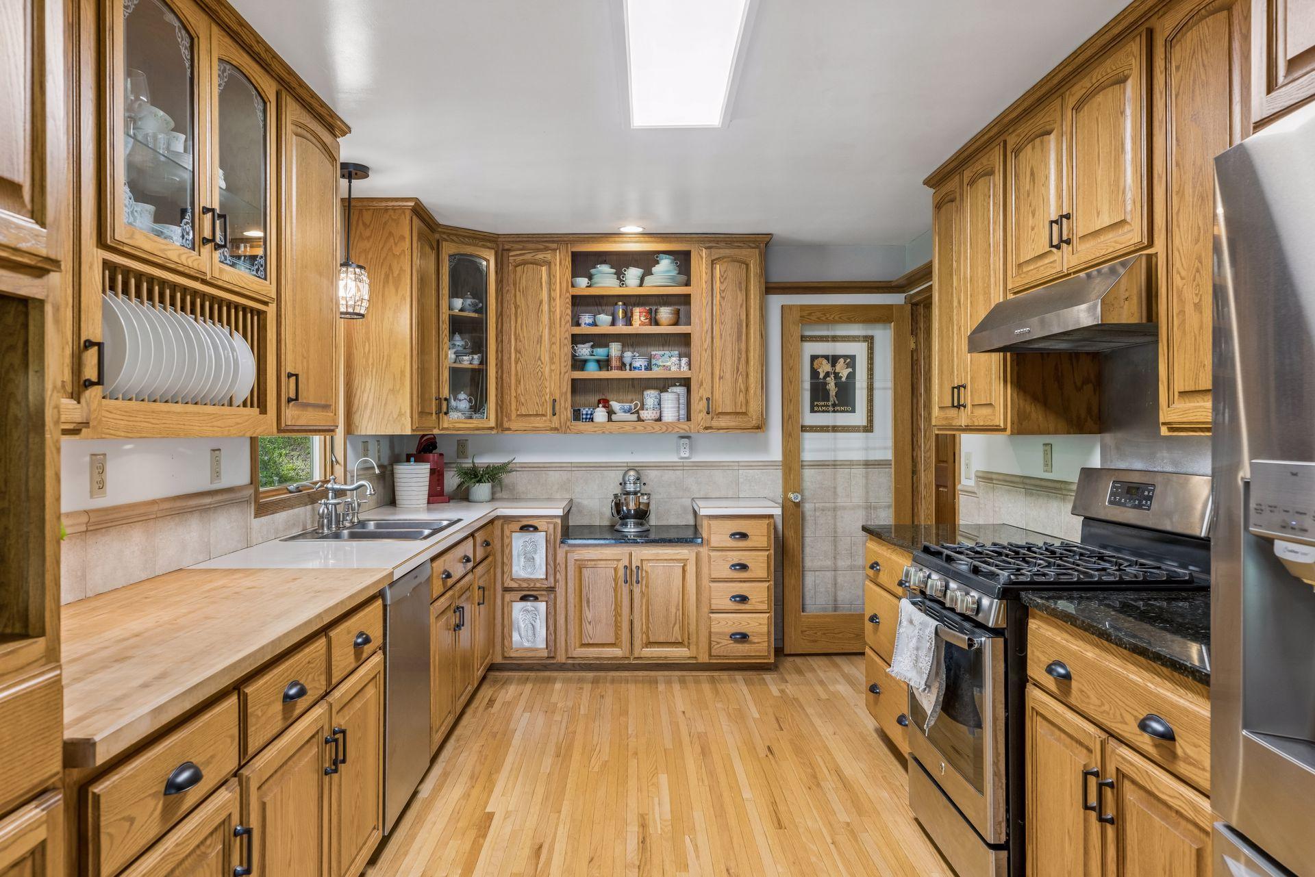 Abundant cabinet space, generous countertops, and a window that brings in natural light.