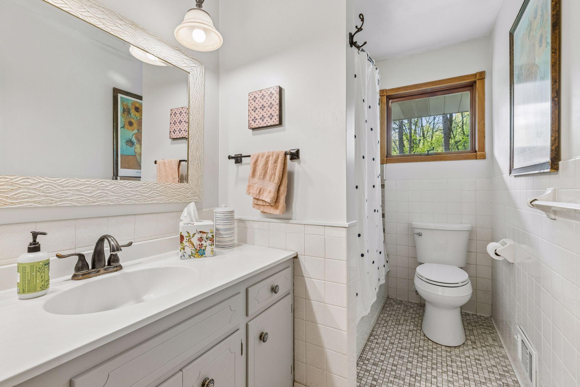 Full bathroom serving the upper level.