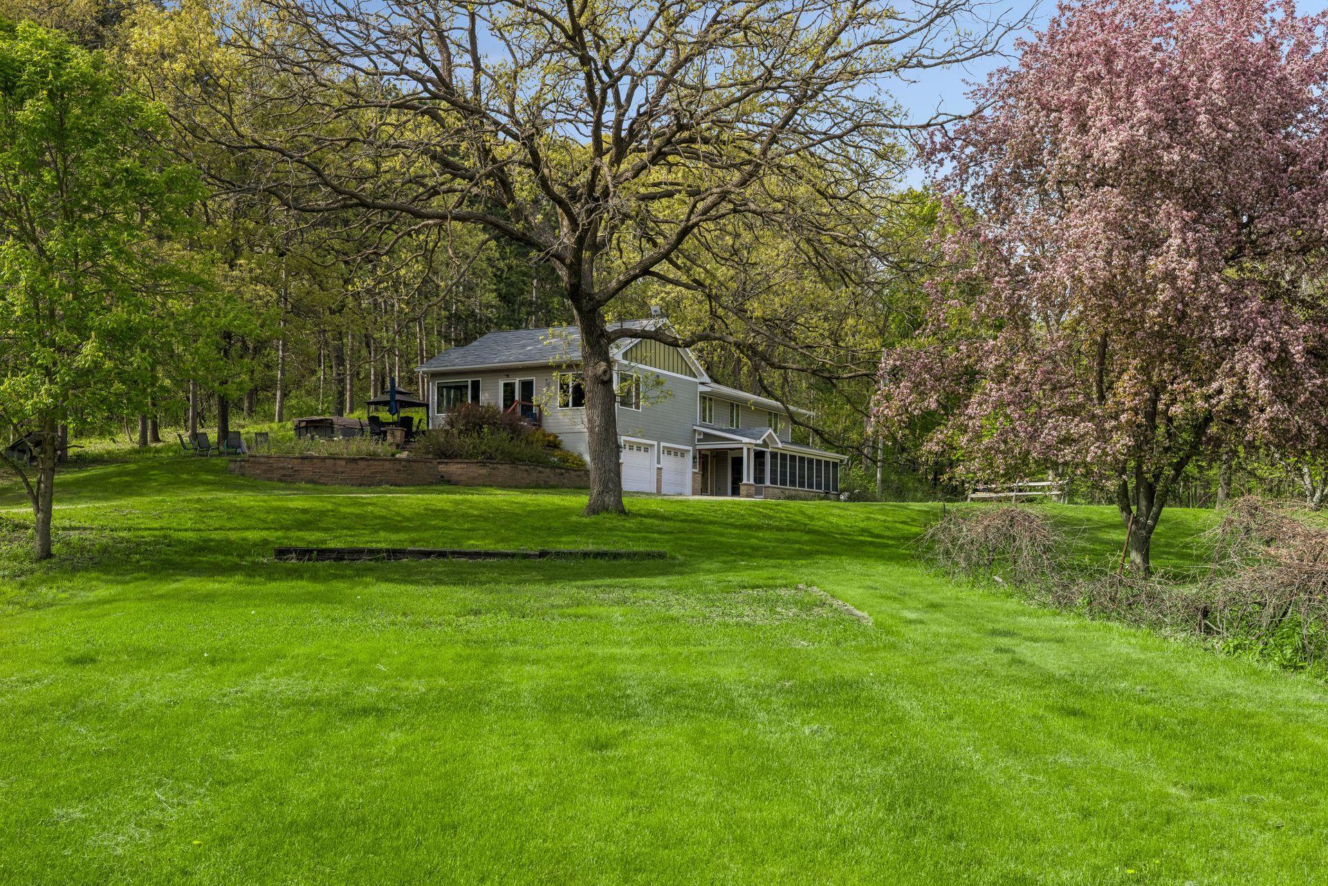Towering trees create a sense of privacy and natural beauty throughout.
