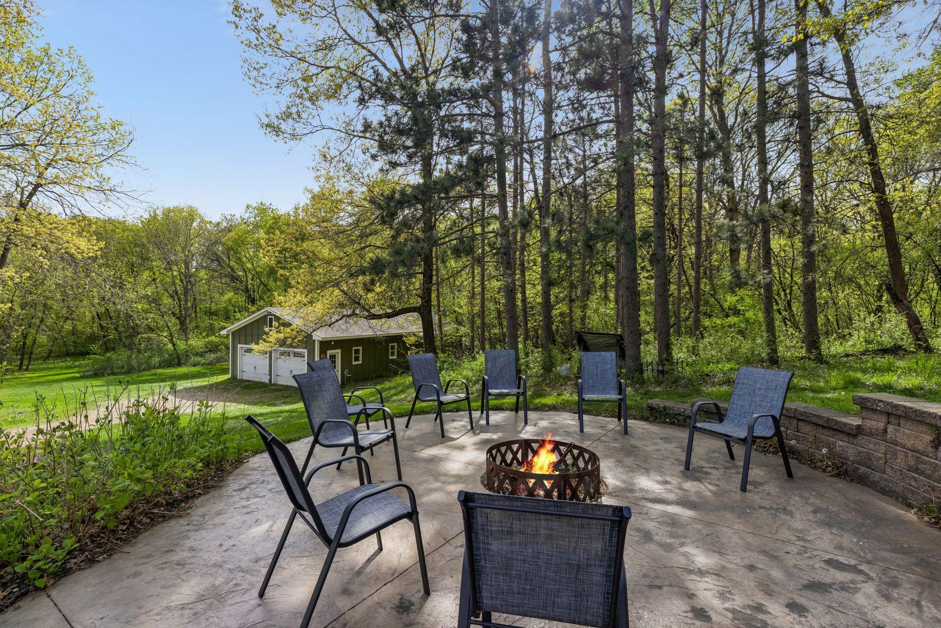 A stunning fire pit and expansive patio space—perfect for entertaining, gathering, and making memories.