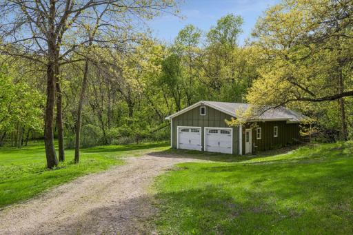 A rare 4-car detached garage with incredible versatilityâgarage space in front and a finished âman caveâ retreat in back.