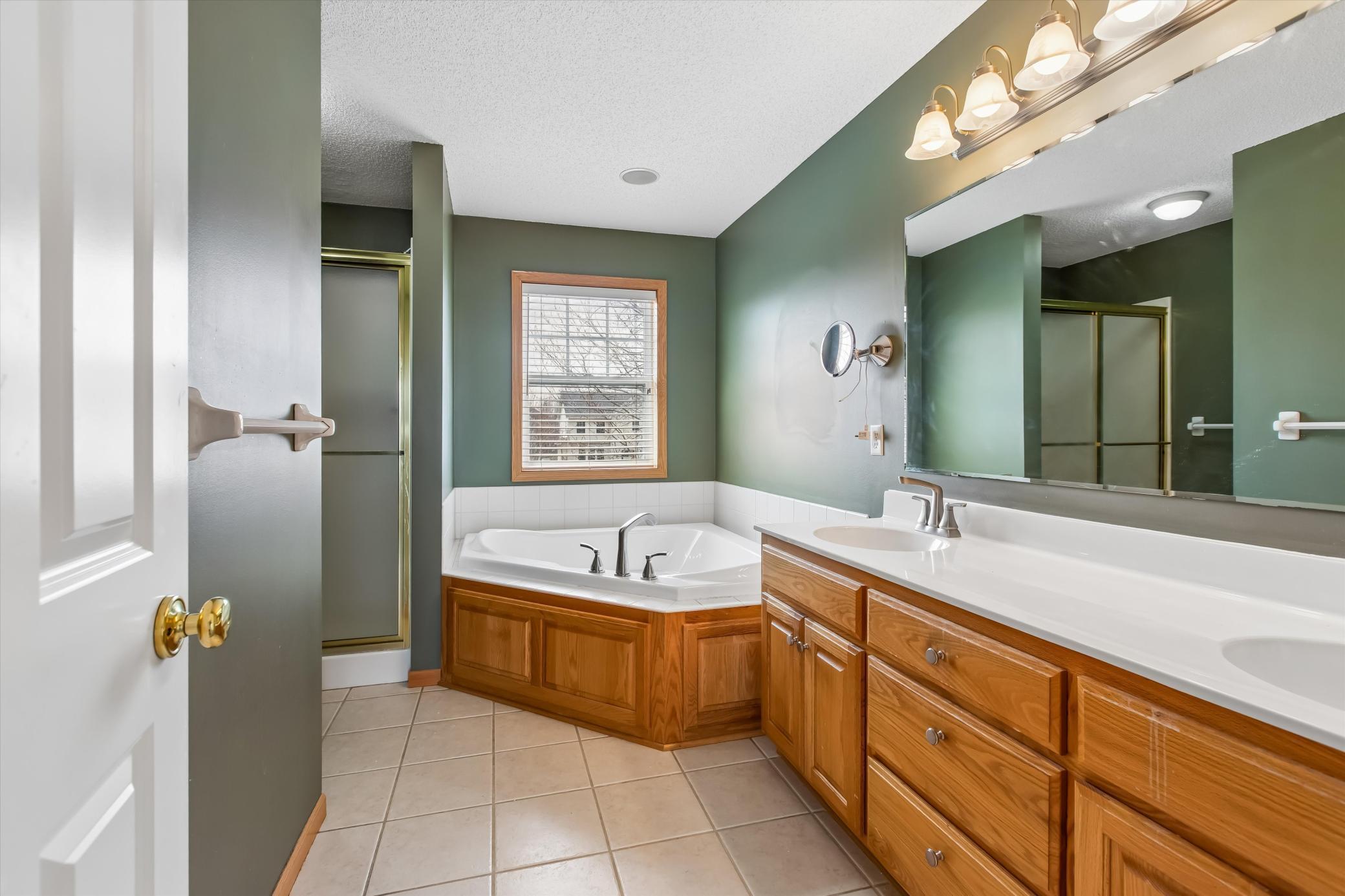 En suite with shower, jetted tub. and dual sinks