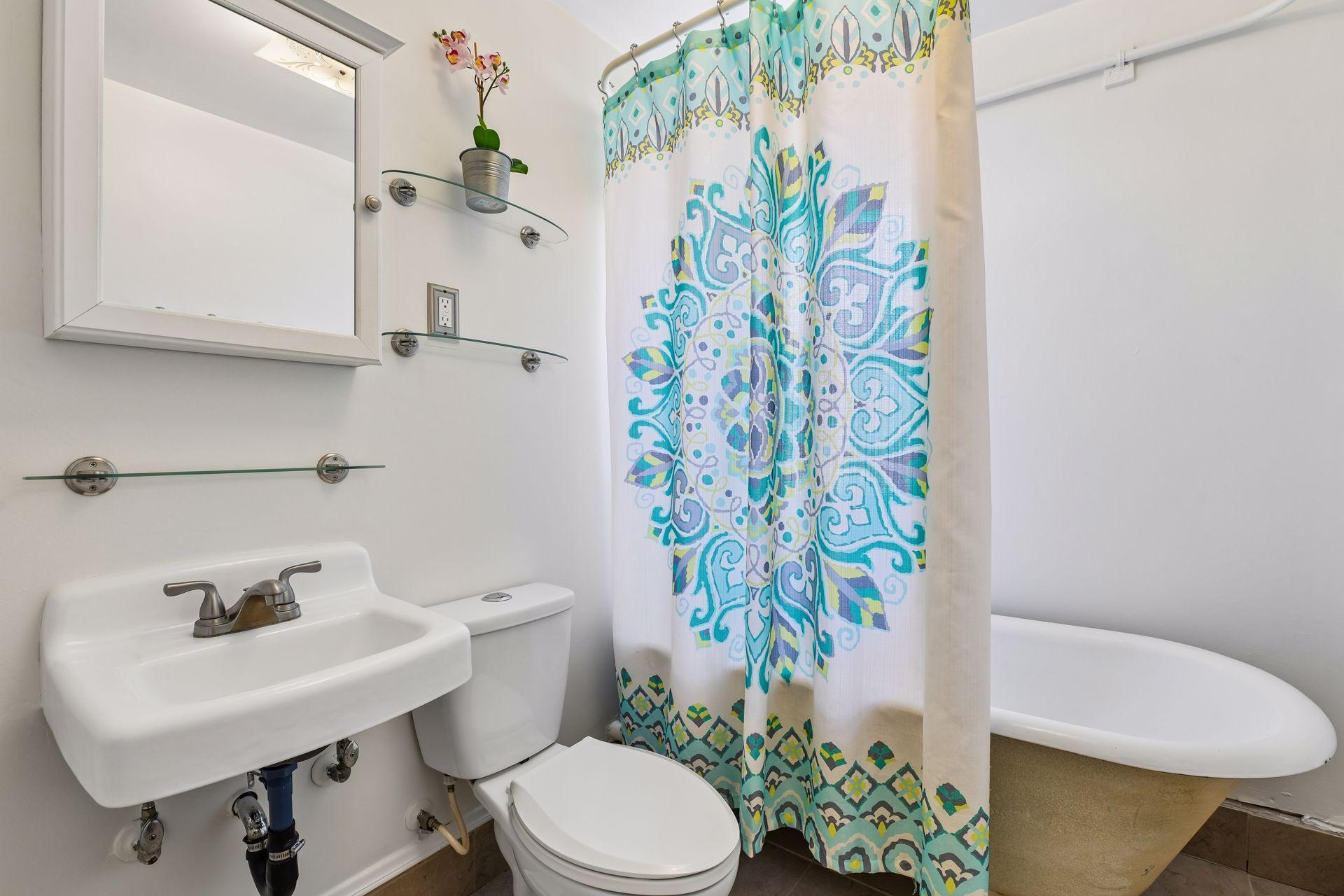 Full bathroom with charming clawfoot tub