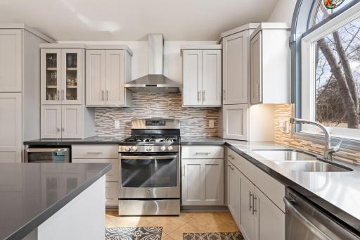 Stunning tile backsplash adds a touch of glam.