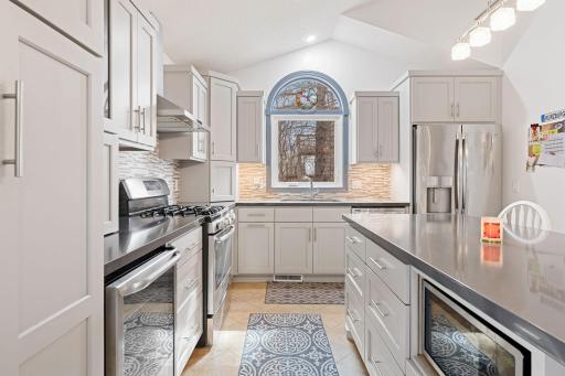 Charming arched window over the kitchen sink.