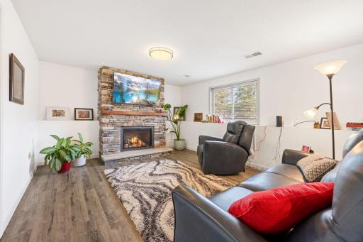 Cozy up next to the high-efficiency gas fireplace with brick surround.