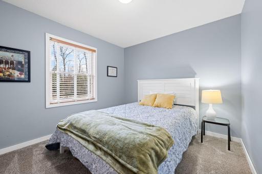 Two additional bedrooms and a full bathroom complete the upper level.