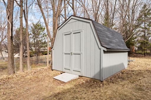 Enjoy the freshly painted shed for storing all of your outdoor tools & machinery.