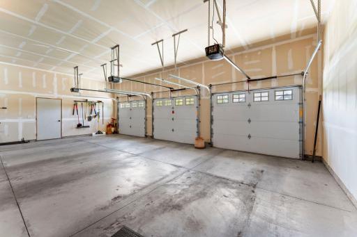 The three-car garage includes 3 garage door openers.