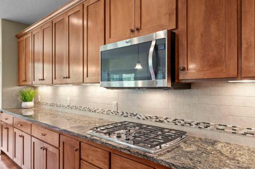 This kitchen features a cooktop and double oven.