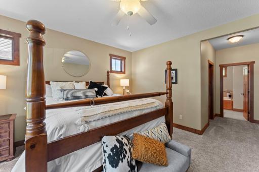 The expansive primary bedroom is located on the main level and includes a huge walk-in closet and private ensuite bathroom.