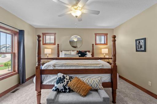 The expansive primary bedroom is located on the main level and includes a huge walk-in closet and private ensuite bathroom.