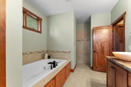 The primary ensuite bathroom features double sinks and a separate tub and walk-in shower.