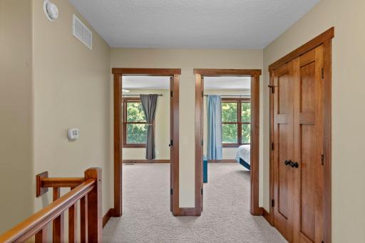 The upper level features three large bedrooms, each with their own walk-in closet.