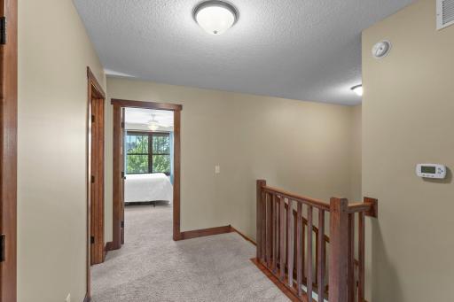 The upper level features three large bedrooms, each with their own walk-in closet.