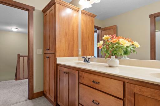 The upper level full bath features double sinks and lots of cabinet space.