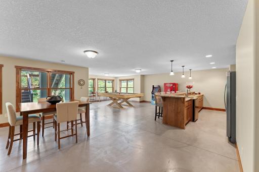 The lower level features a wet bar and colored concrete floors, complete with in-floor heat!