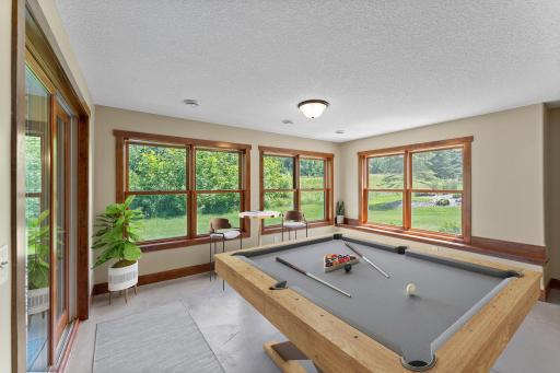 The family room is lined with windows to offer views of the golf course.