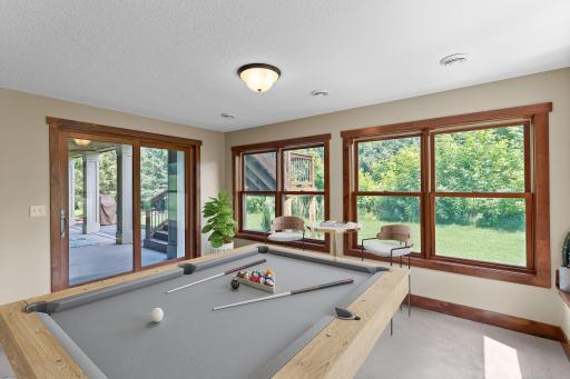 The family room is lined with windows to offer views of the golf course.