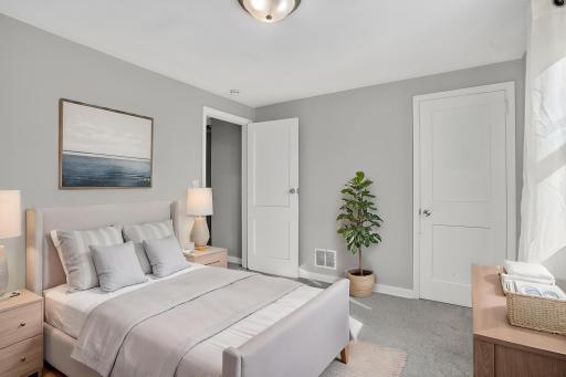 Beautiful virtually staged secondary upper-level bedroom to help you envision its full potential.