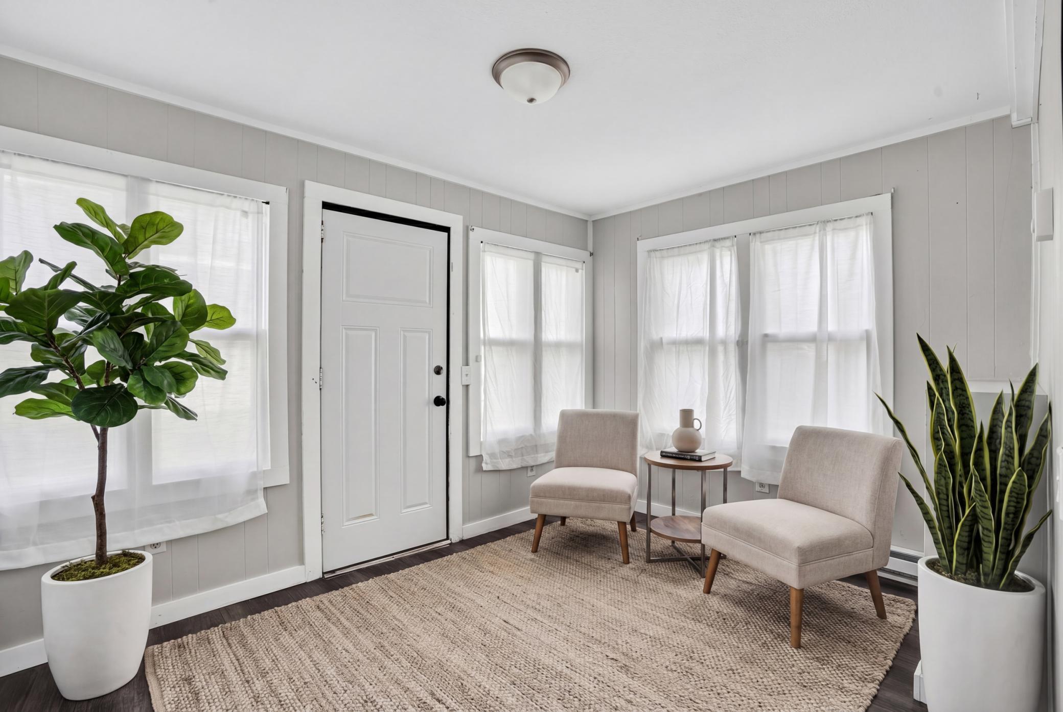 Beautiful virtually staged sunroom to help you envision its full potential.