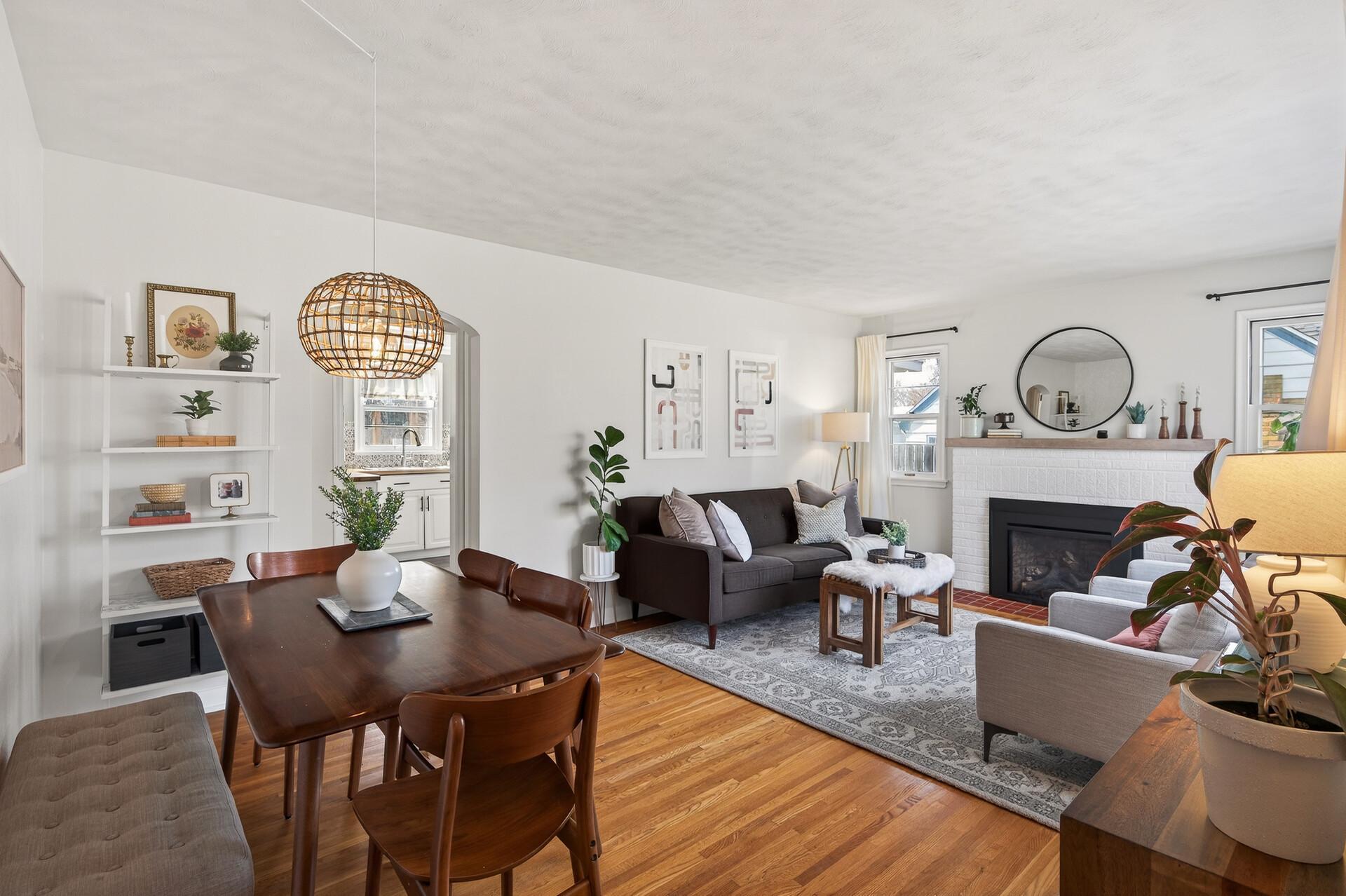 The sunny living and dining rooms have gleaming hardwood floors, a cozy gas fireplace, and room for everyone.
