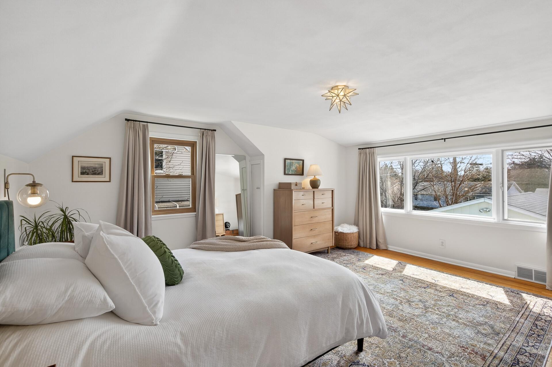 This large primary is on the upper level and next to the 3/4 bathrooom