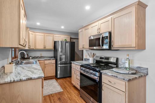Totally remodeled, new kitchen! Appliances, cabinets, countertops, lighting, and more!!