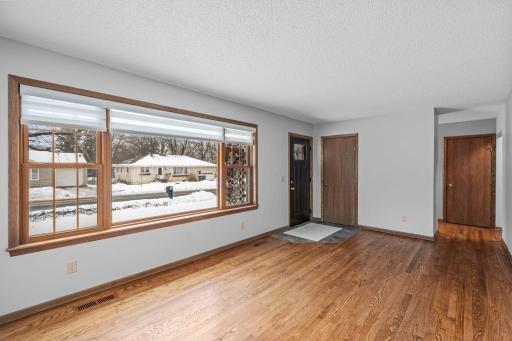 Gorgeous hardwood floor! Large new windows bring in a ton of natural light. New doors, trim throughout!