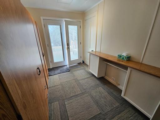 Door is double opening with shades inside the glass