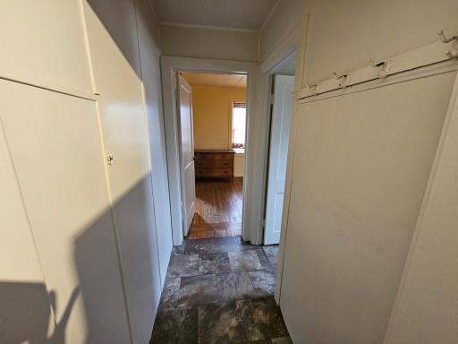 Hallway from entry room to main floor room