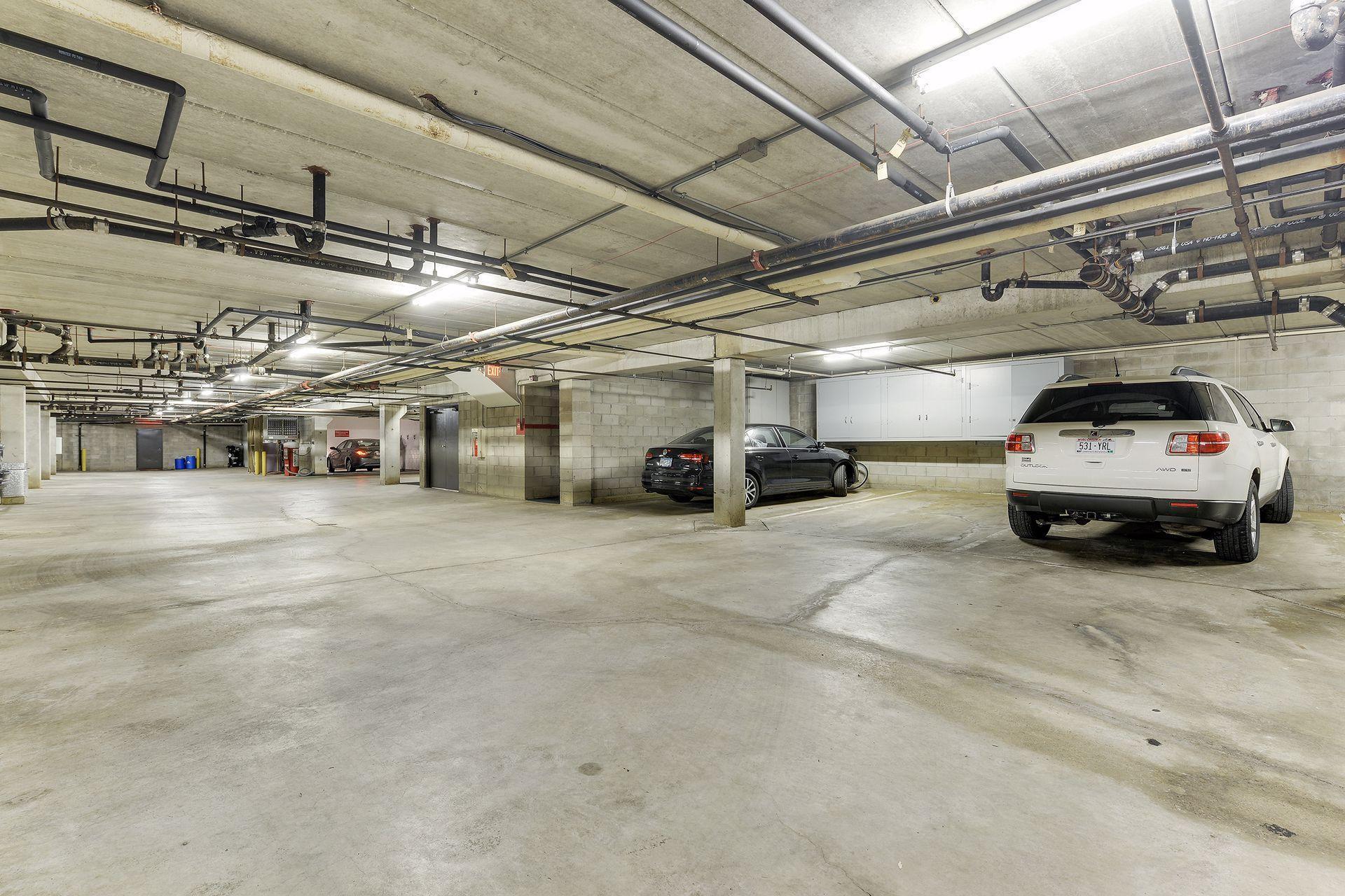 Two heated, underground parking stalls with storage space