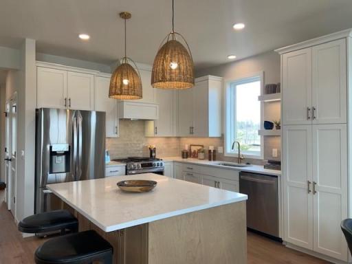 Photos are taken from current model home which reflects design finishes. Upgrades, options and finishes will vary.