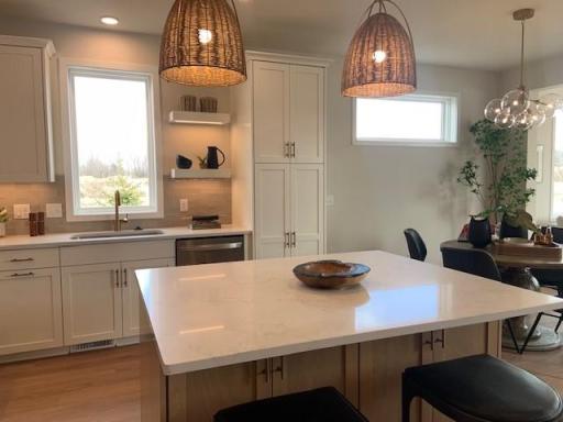 Photos are taken from current model home which reflects design finishes. Upgrades, options and finishes will vary.