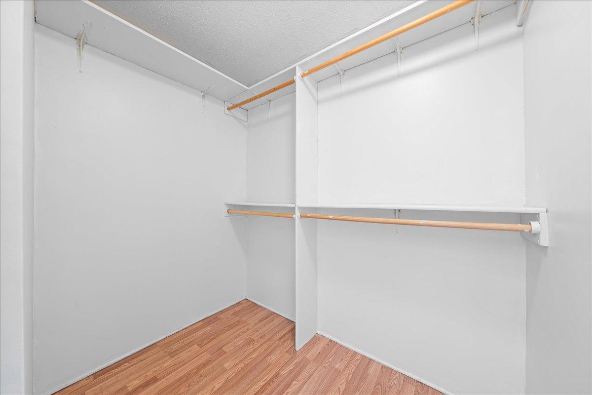 Primary bedroom walk-in closet.