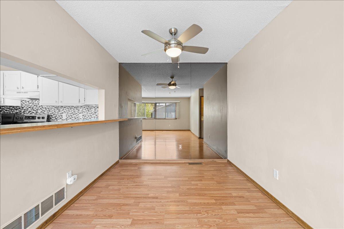 Dining room with ceiling fan.