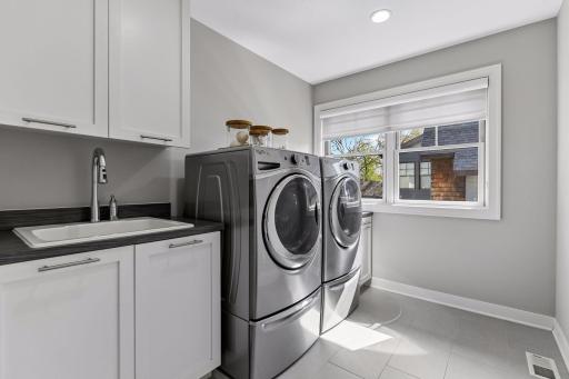The upstairs laundry just outside the primary suite