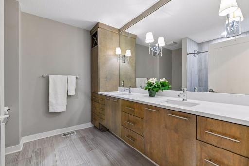 2nd floor bathroom with dual sinks and quartz countertops