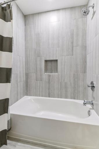 The second bathroom also has a tub and shower for bath time with kids