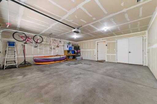 An oversized two car tuck-under garage with enough space for your toys