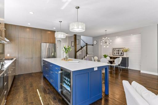 There is a convenient and spacious work surface with high end Bosch appliances and natural light. The beverage refrigerator adds extra space for refrigeration
