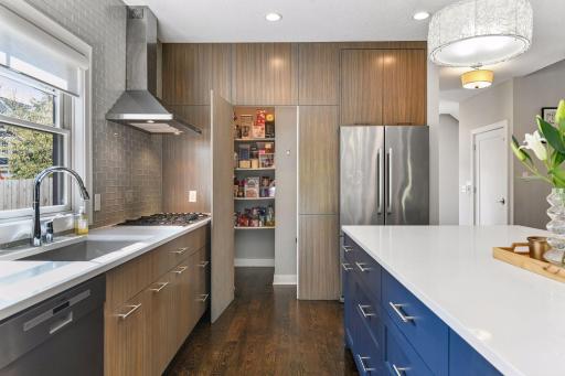 The walk in pantry for extra storage. The gas cooktop is vented to the outside and the cabinets have soft close drawers and are fitted with the newest hardware and features
