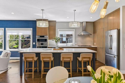 The kitchen island with quartz countertops and seating for four