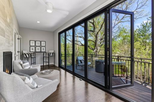 15 feet of solid glass doors that slide open to bring the outside in or close the sliding screen